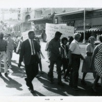 Harold Brown marching with demonstrators, 1964